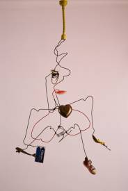 Sylvain ZABETH - 1991 Paris 'Merde au Sida 'ceintre métallique déformés et attachés  avec accumulation d'objets divers collées peinture acrylique 92x55ccm.jpg